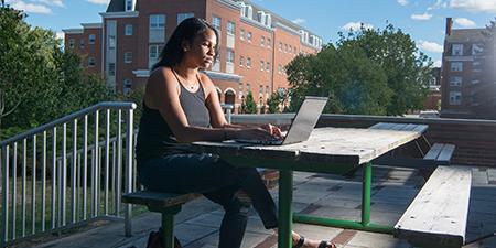 Student works at laptop